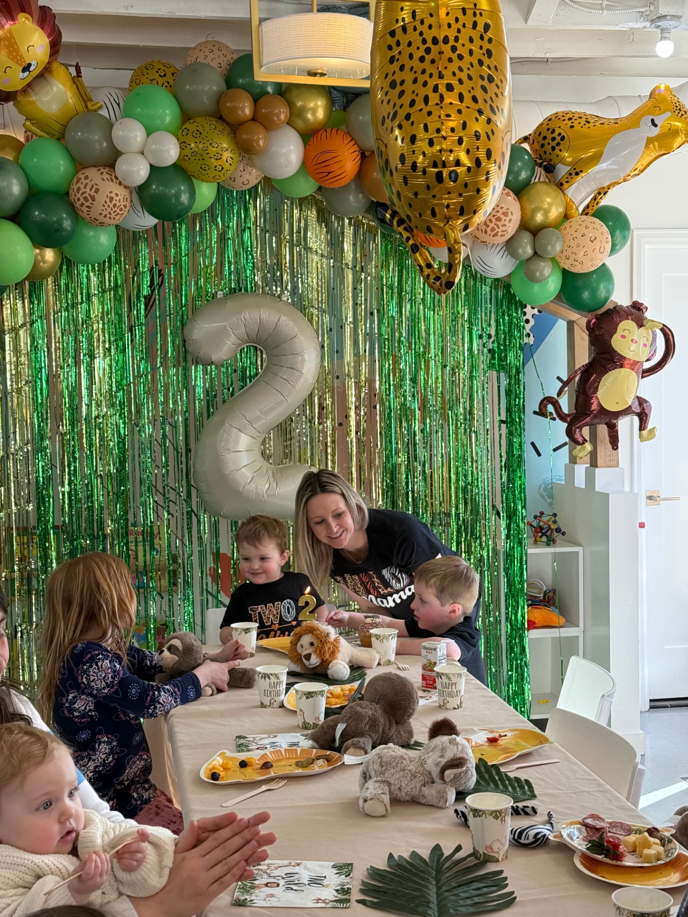 Pastel balloon arch and decorated table at a kids birthday party in tumble HAUS Denver